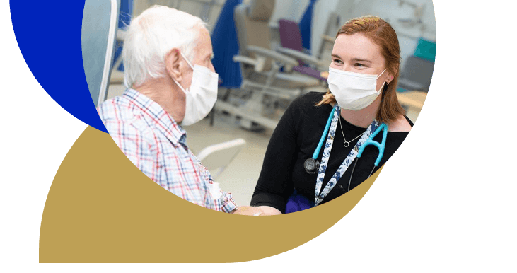 Female doctor speaking with elderly patient